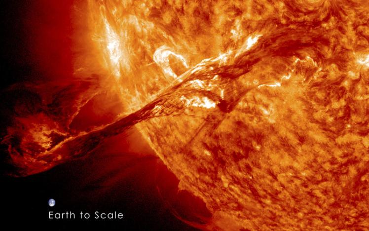 A long filament of solar material that had been hovering in the Sun's atmosphere erupts out into space